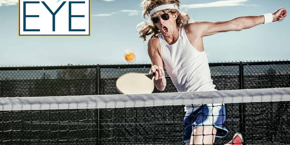 Man with a mullet playing pickleball in sunglasses, exuding style and humor on the court