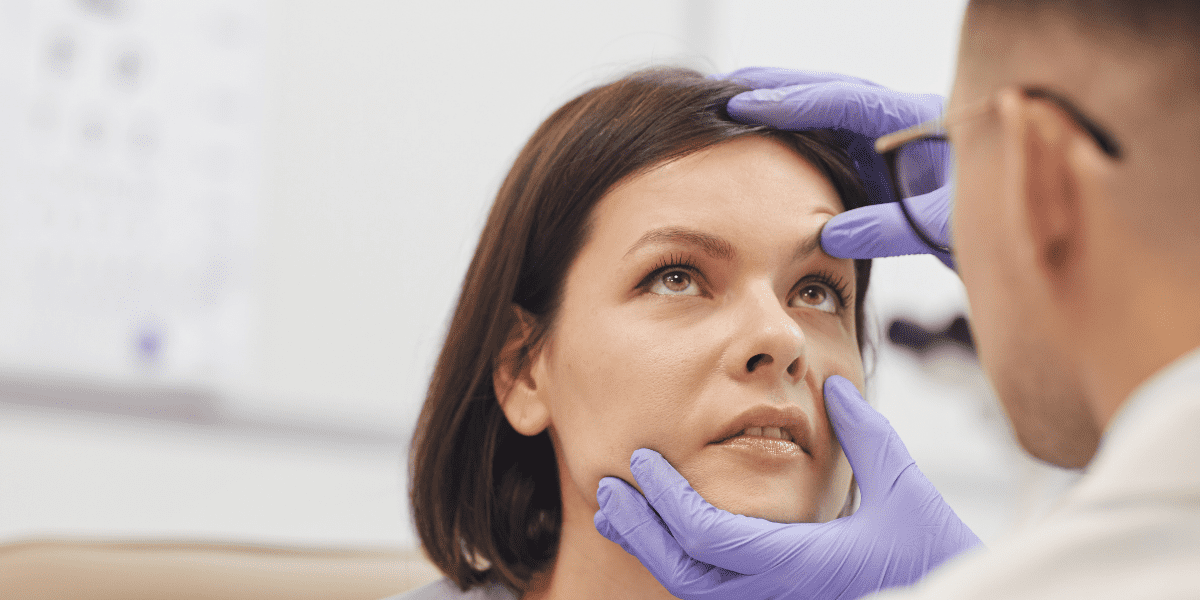 Doctor looking in patients eye