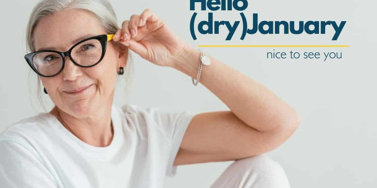 Older attractive woman with grey hair wearing colorful eyeglasses and smiling
